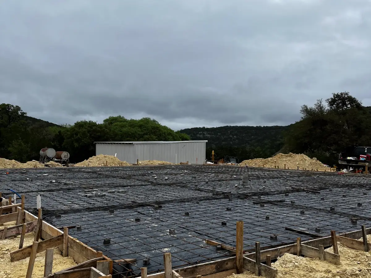 Formed and reinforced shop foundation ready for a concrete pour in the Texas Hill Country